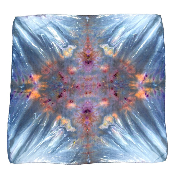 Blue, White, Purple and Orange multi-colored luxury silk bandana scarf in a diamond shibori pattern, sustainable wear with many style looks. Best fashion accessory for any season or occasion. Makes a great gift. Handmade one of a kind artisan accessories. Square shaped 21 inches by 21 inches.