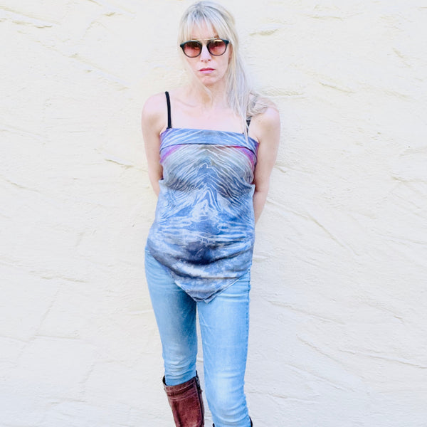 Model is wearing a rainbow multi colored large luxury silk square scarf in striped safari shibori pattern as a tube top tied in back, sustainable wear with many style looks. Best fashion accessory for any season or occasion. Makes a great gift. Handmade one of a kind artisan accessories. Square shaped 43 inches by 43 inches.