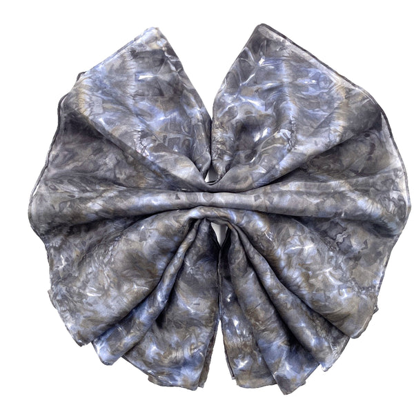 Charcoal blue luxury silk scarf in tie dye shibori pattern, sustainable wear with many style looks. Best fashion accessory for any season or occasion. Makes a great gift. Handmade one of a kind artisan accessories. Rectangle shaped 14 inches by 70 inches.