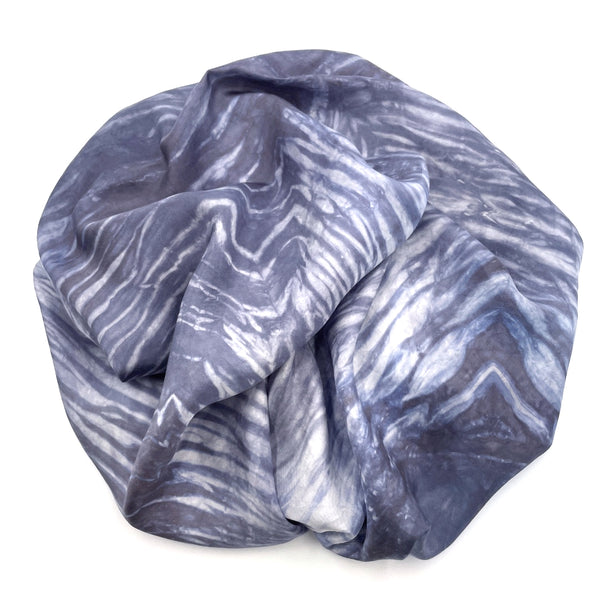 Slate grey, blue and white luxury silk scarf shawl in tie dye shibori pattern, sustainable wear with many style looks. Best fashion accessory for any season or occasion. Makes a great gift. Handmade one of a kind artisan accessories. Square shaped 43 inches by 43 inches.