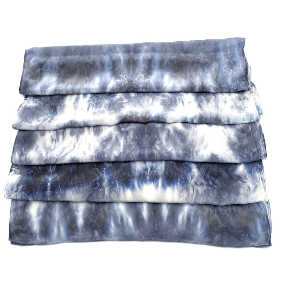 Slate grey, blue and white luxury silk scarf shawl in tie dye shibori pattern, sustainable wear with many style looks. Best fashion accessory for any season or occasion. Makes a great gift. Handmade one of a kind artisan accessories. Rectangle shaped 20 inches by 88 inches.