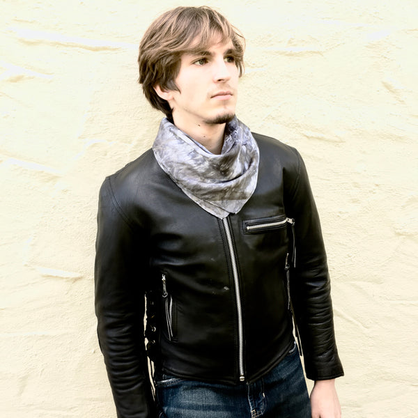 Model is wearing black charcoal luxury silk bandana scarf tied in back, sustainable wear with many style looks. Best fashion accessory for any season or occasion. Makes a great gift. Handmade one of a kind artisan accessories. Square dimension 21 inches by 21 inches.