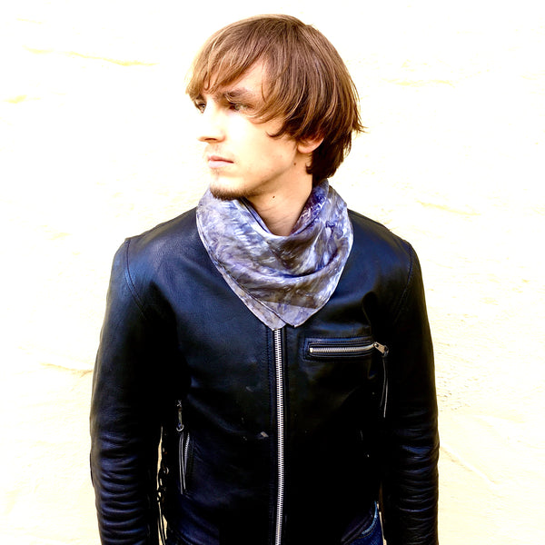 Model is wearing black charcoal luxury silk bandana scarf tied in back, sustainable wear with many style looks. Best fashion accessory for any season or occasion. Makes a great gift. Handmade one of a kind artisan accessories. Square dimension 21 inches by 21 inches.