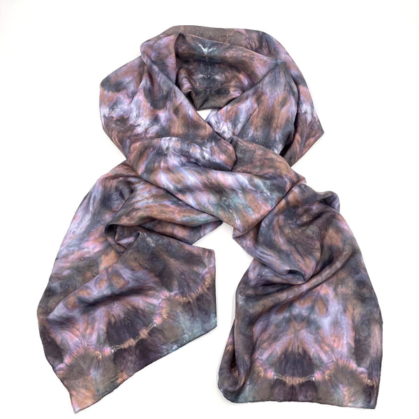 Beautiful multi-colored luxury silk scarf shawl featuring natural jewel toned colors in tie dye shibori pattern, sustainable wear with many style looks. Best fashion accessory for any season or occasion. Makes a great gift. Handmade one of a kind artisan accessories. Rectangle shaped 22 inches by 88 inches.