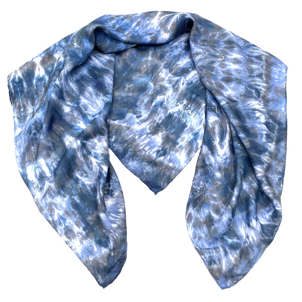 Blue luxury large silk square scarf shawl in tie dye shibori pattern, sustainable wear with many style looks. Best fashion accessory for any season or occasion. Makes a great gift. Handmade one of a kind artisan accessories. Square shaped 43 inches by 43 inches.