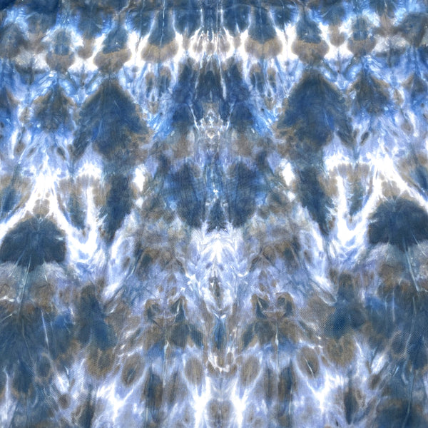 Blue luxury large silk square scarf shawl in tie dye shibori pattern, sustainable wear with many style looks. Best fashion accessory for any season or occasion. Makes a great gift. Handmade one of a kind artisan accessories. Square shaped 43 inches by 43 inches.