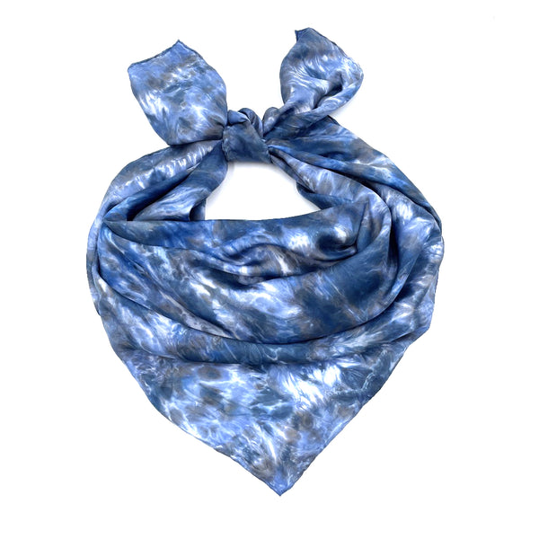 Blue luxury large silk square scarf shawl in tie dye shibori pattern, sustainable wear with many style looks. Best fashion accessory for any season or occasion. Makes a great gift. Handmade one of a kind artisan accessories. Square shaped 43 inches by 43 inches.