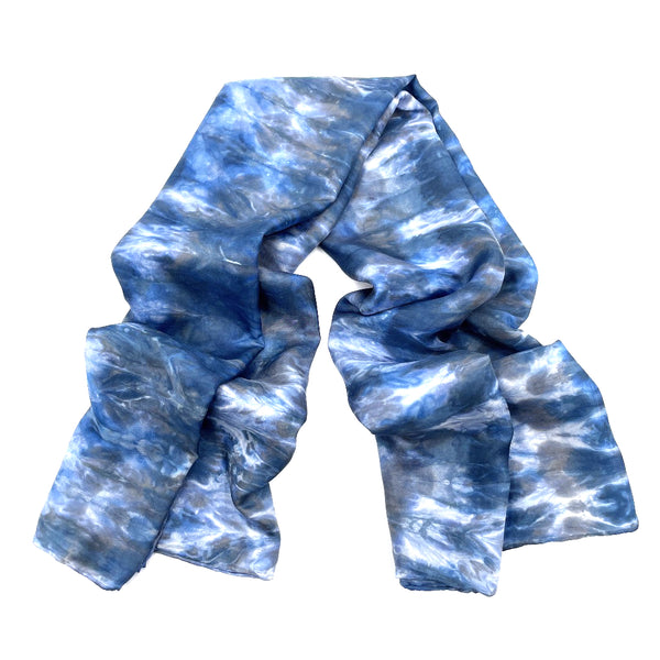 Blue luxury large silk square scarf shawl in tie dye shibori pattern, sustainable wear with many style looks. Best fashion accessory for any season or occasion. Makes a great gift. Handmade one of a kind artisan accessories. Square shaped 43 inches by 43 inches.
