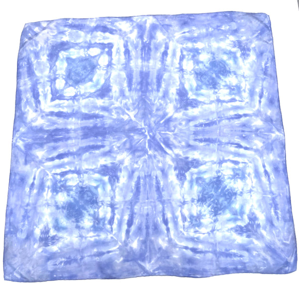 Periwinkle blue luxury silk bandana scarf in geometric shibori pattern, sustainable wear with many style looks. Best fashion accessory for any season or occasion. Makes a great gift. Handmade one of a kind artisan accessories. Square shaped 28 inches by 28 inches.