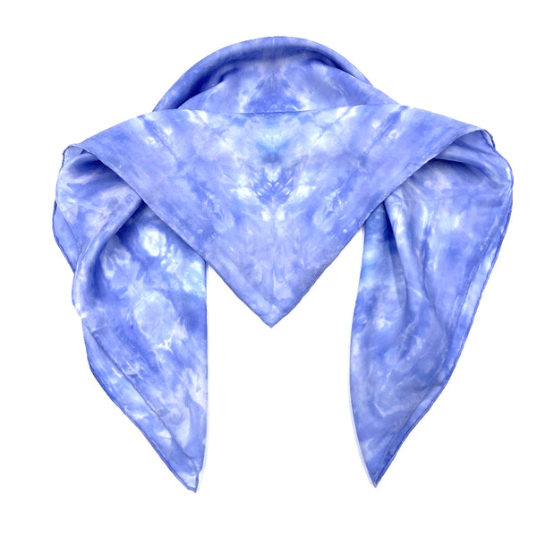 Periwinkle blue luxury silk bandana scarf in geometric shibori pattern, sustainable wear with many style looks. Best fashion accessory for any season or occasion. Makes a great gift. Handmade one of a kind artisan accessories. Square shaped 28 inches by 28 inches.