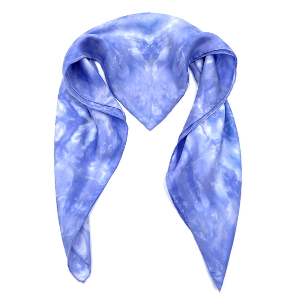 Periwinkle blue luxury silk bandana scarf in geometric shibori pattern, sustainable wear with many style looks. Best fashion accessory for any season or occasion. Makes a great gift. Handmade one of a kind artisan accessories. Square shaped 28 inches by 28 inches.
