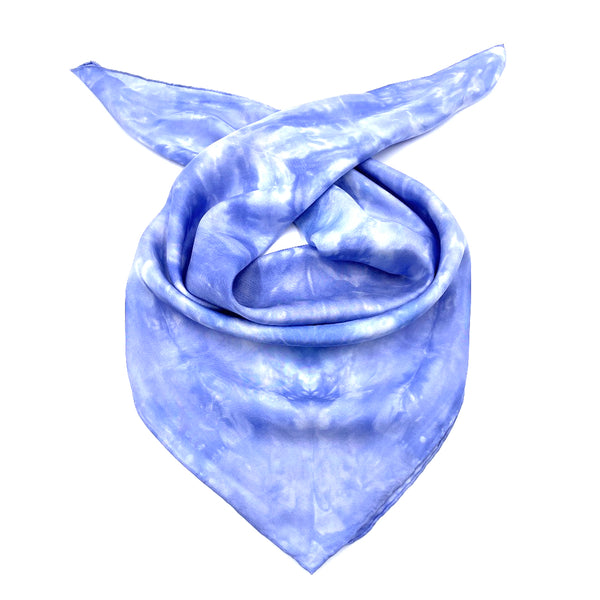 Periwinkle blue luxury silk bandana scarf in geometric shibori pattern, sustainable wear with many style looks. Best fashion accessory for any season or occasion. Makes a great gift. Handmade one of a kind artisan accessories. Square shaped 28 inches by 28 inches.