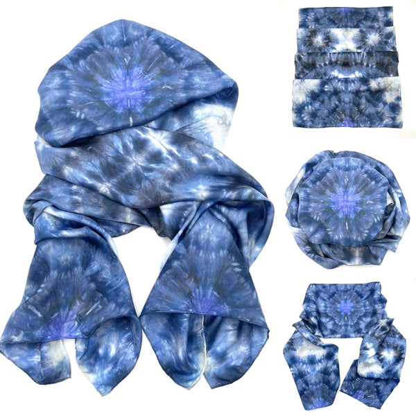 Images of a Beautiful handmade 20”x88” hand dyed  100% SUSTAINABLE Rectangular Silk Scarf Shawl with hand rolled hem in various hues of blue, grey and white featuring a mosaic snowflake kaleidoscope design.