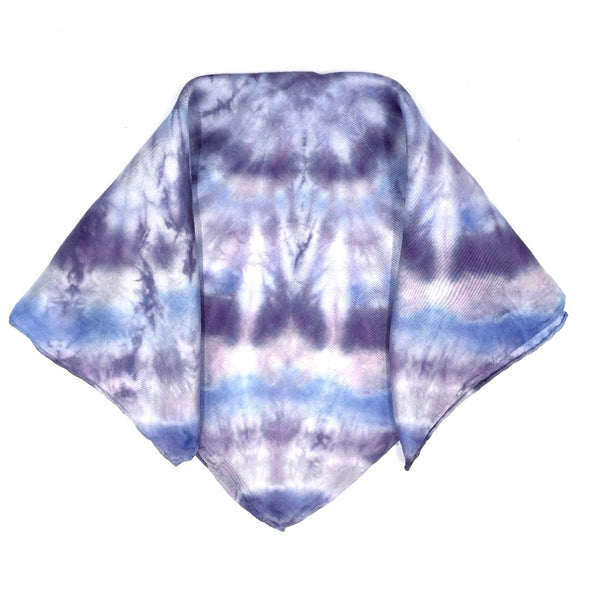 Blue and purple luxury silk pocket square scarf in circular bullseye shibori pattern, sustainable wear with many style looks. Best fashion accessory for any season or occasion. Makes a great gift. Handmade one of a kind artisan accessories. Square shaped 17 inches by 17 inches.
