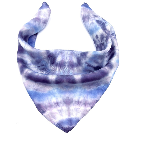 Blue and purple luxury silk pocket square scarf in circular bullseye shibori pattern, sustainable wear with many style looks. Best fashion accessory for any season or occasion. Makes a great gift. Handmade one of a kind artisan accessories. Square shaped 17 inches by 17 inches.
