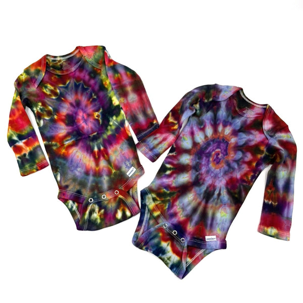 Multi-colored Rainbow spiral swirl hand dyed baby onesie a on a white background. Gender neutral.  Makes a great gift!