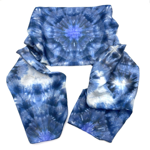 Beautiful handmade 20”x88” hand dyed  100% SUSTAINABLE Rectangular Silk Scarf Shawl with hand rolled hem in various hues of blue, grey and white featuring a mosaic snowflake kaleidoscope design.