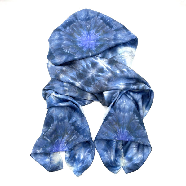 Beautiful handmade 20”x88” hand dyed  100% SUSTAINABLE Rectangular Silk Scarf Shawl with hand rolled hem in various hues of blue, grey and white featuring a mosaic snowflake kaleidoscope design.
