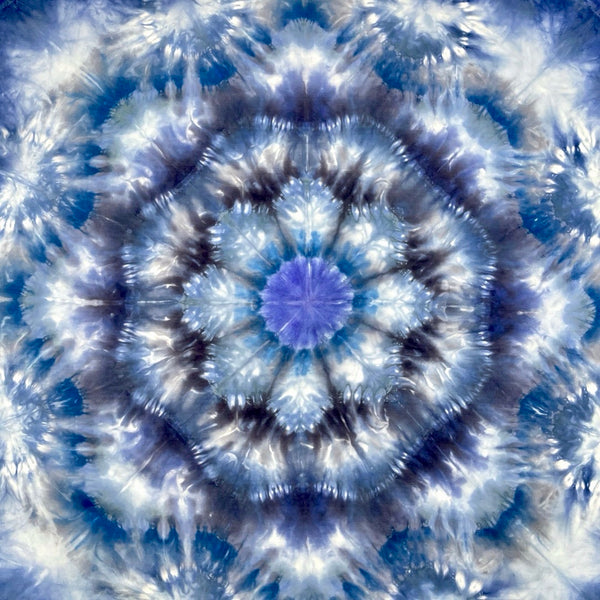 Square blue and white silk scarf measuring 30 inches by 30 inches featuring a geometric eight point circular mandala kaleidoscope pattern. 