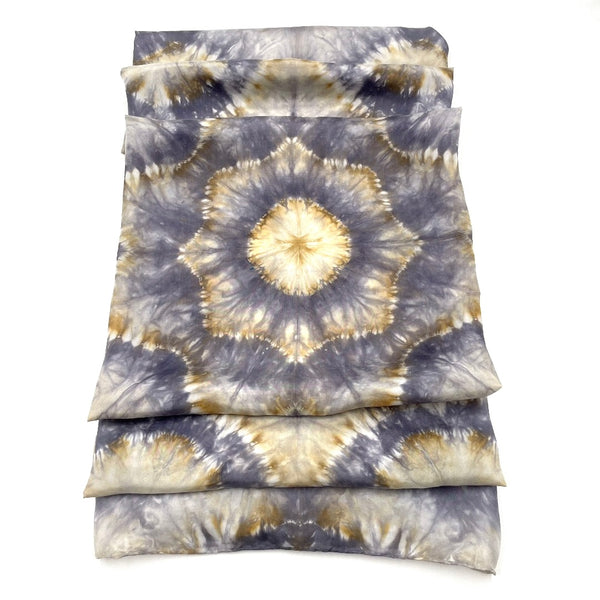 Gorgeous handmade shibori snowflake flower patterned square silk scarf measuring 43 inches by 43 inches in silver and gold hues. 