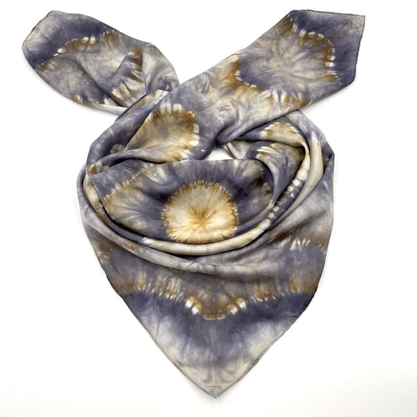 Gorgeous handmade shibori snowflake flower patterned square silk scarf measuring 43 inches by 43 inches in silver and gold hues. 