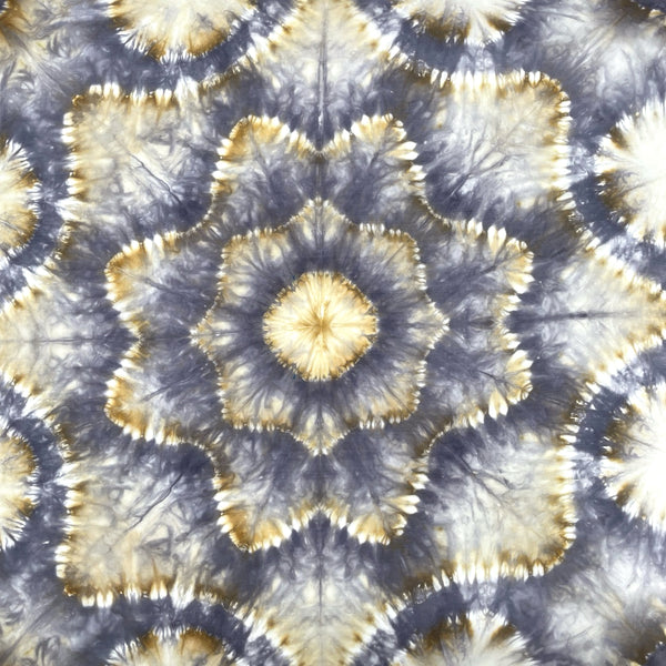 Patterned silk scarf shawl with circular flower mandala design in beige and grey.