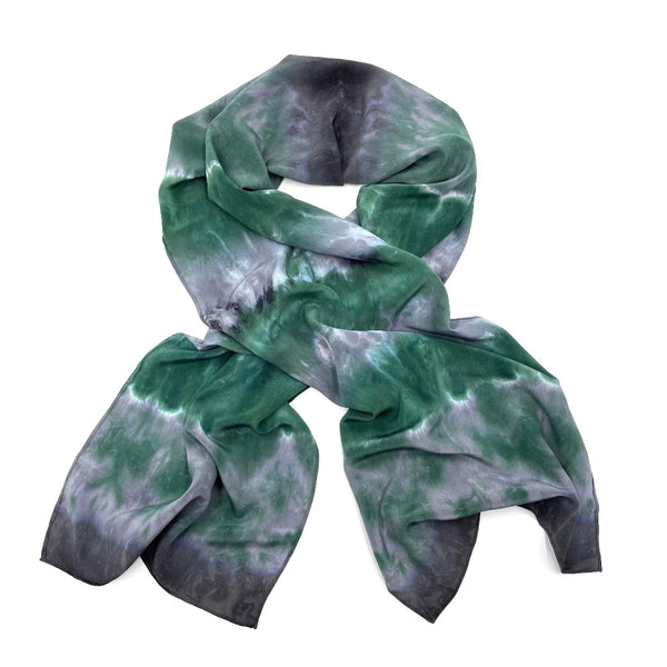 Green and gray luxury silk scarf in tie dye shibori pattern, sustainable wear with many style looks. Best fashion accessory for any season or occasion. Makes a great gift. Handmade one of a kind artisan accessories. Rectangle shaped 14 inches by 70 inches.