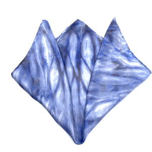 Indigo blue luxury silk pocket square scarf in striped shibori pattern, sustainable wear with many style looks. Best fashion accessory for any season or occasion. Makes a great gift. Handmade one of a kind artisan accessories. Square shaped 17 inches by 17 inches.