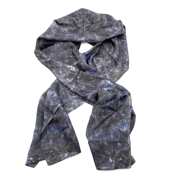 Charcoal blue luxury silk scarf in tie dye shibori pattern, sustainable wear with many style looks. Best fashion accessory for any season or occasion. Makes a great gift. Handmade one of a kind artisan accessories. Rectangle shaped 14 inches by 70 inches.