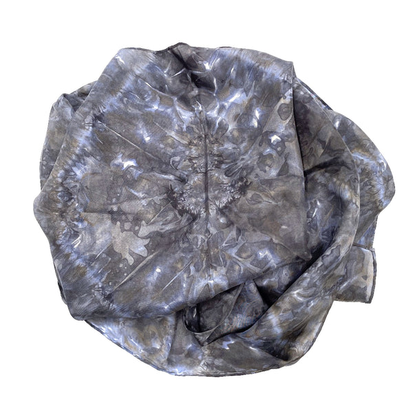 Charcoal blue luxury silk scarf in tie dye shibori pattern, sustainable wear with many style looks. Best fashion accessory for any season or occasion. Makes a great gift. Handmade one of a kind artisan accessories. Rectangle shaped 14 inches by 70 inches.