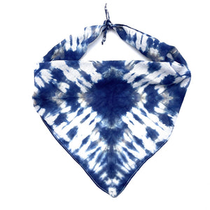 100% natural breathable triangular cotton bandana measuring 22"x22"x29" inches in a beautiful tie dyed shibori pattern in indigo blue.  Each bandana is custom made for your furry friend providing one-of-a-kind style.  No two are alike, and are not made by factory/machine! Lines are not perfect by intention and add to the character of the design. Machine washable and dryer friendly.