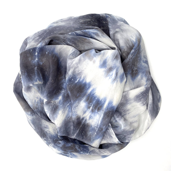 Slate grey, blue and white luxury silk scarf shawl in tie dye shibori pattern, sustainable wear with many style looks. Best fashion accessory for any season or occasion. Makes a great gift. Handmade one of a kind artisan accessories. Rectangle shaped 20 inches by 88 inches.