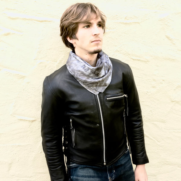 Model is wearing black charcoal luxury silk bandana scarf tied in back, sustainable wear with many style looks. Best fashion accessory for any season or occasion. Makes a great gift. Handmade one of a kind artisan accessories. Square dimension 21 inches by 21 inches.