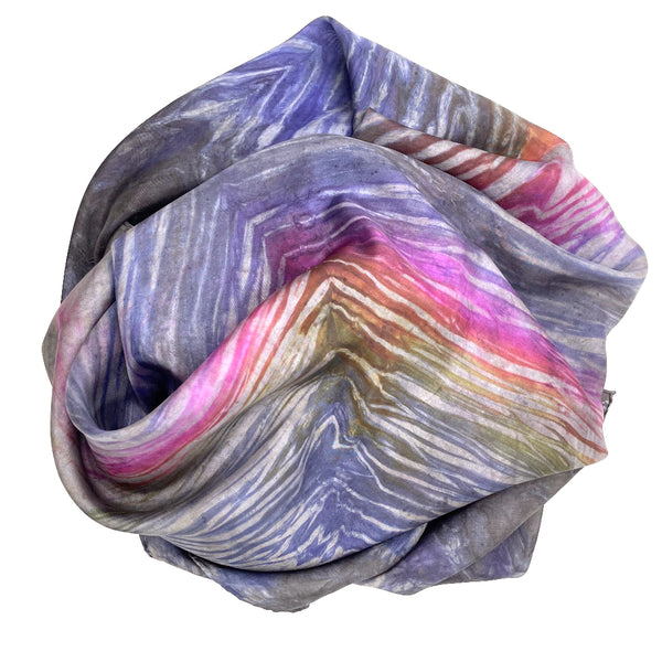 Rainbow multi colored large luxury silk square scarf in striped safari shibori pattern, sustainable wear with many style looks. Best fashion accessory for any season or occasion. Makes a great gift. Handmade one of a kind artisan accessories. Square shaped 43 inches by 43 inches.