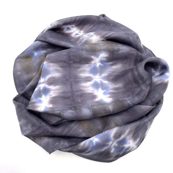 Black Charcoal and blue large luxury silk square scarf in striped shibori pattern, sustainable wear with many style looks. Best fashion accessory for any season or occasion. Makes a great gift. Handmade one of a kind artisan accessories. Square shaped 43 inches by 43 inches.