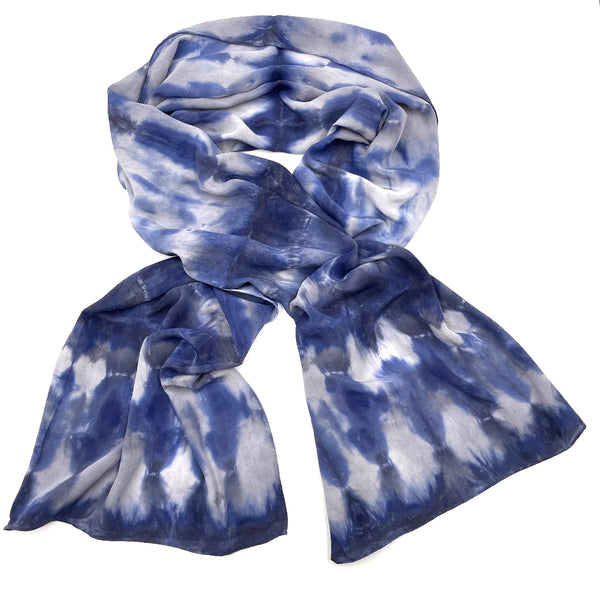 Indigo blue luxury silk scarf shawl in tie dye shibori pattern, sustainable wear with many style looks. Best fashion accessory for any season or occasion. Makes a great gift. Handmade one of a kind artisan accessories. Rectangle shaped 20 inches by 88 inches.