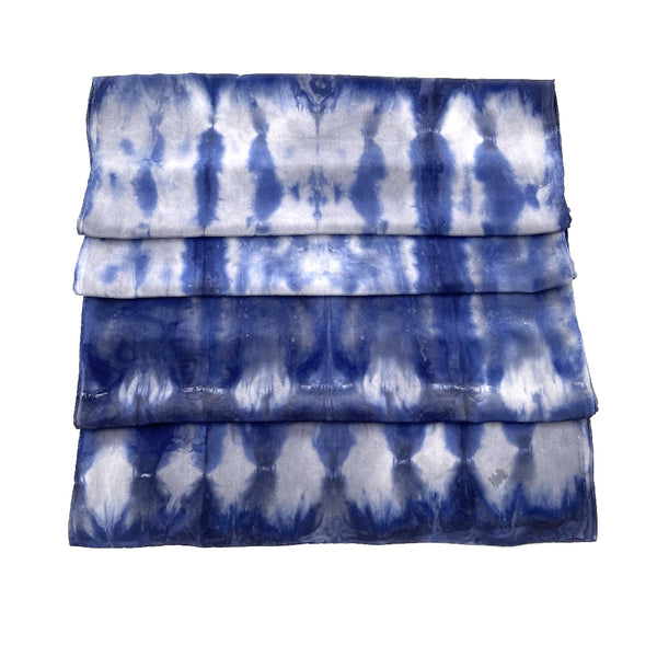 Indigo blue luxury silk scarf shawl in tie dye shibori pattern, sustainable wear with many style looks. Best fashion accessory for any season or occasion. Makes a great gift. Handmade one of a kind artisan accessories. Rectangle shaped 20 inches by 88 inches.