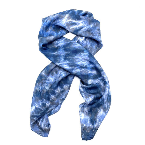 Blue luxury large silk square scarf shawl in tie dye shibori pattern, sustainable wear with many style looks. Best fashion accessory for any season or occasion. Makes a great gift. Handmade one of a kind artisan accessories. Square shaped 43 inches by 43 inches.