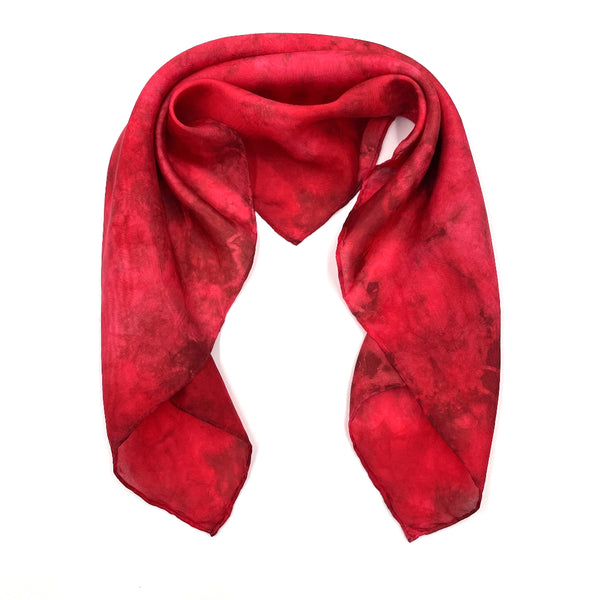 Vibrant red luxury silk bandana scarf in variegated tie dye shibori pattern, sustainable wear with many style looks. Best fashion accessory for any season or occasion. Makes a great gift. Handmade 21 inches by 21 inches square shaped, one of a kind artisan accessories.