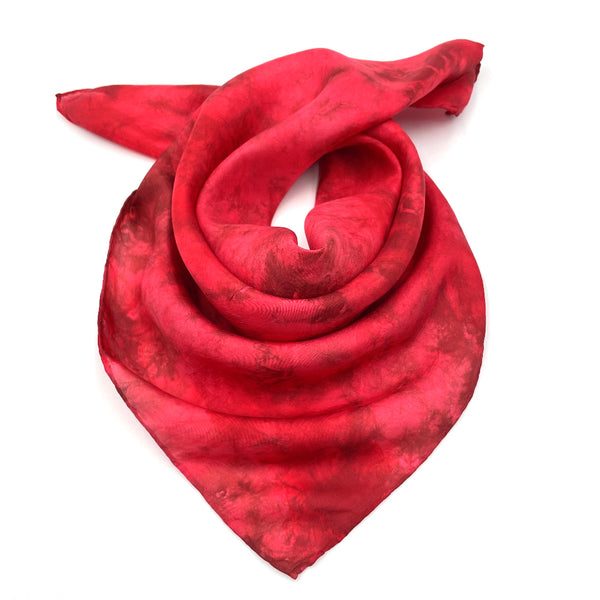 Vibrant red luxury silk bandana scarf in variegated tie dye shibori pattern, sustainable wear with many style looks. Best fashion accessory for any season or occasion. Makes a great gift. Handmade 21 inches by 21 inches square shaped, one of a kind artisan accessories.
